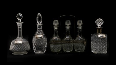 Lot 128A - A set of three cut-glass decanters