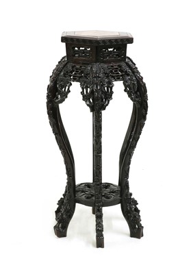 Lot 222 - A Chinese hardwood vase stand
