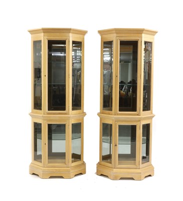 Lot 374 - A pair of contemporary light oak display cabinets
