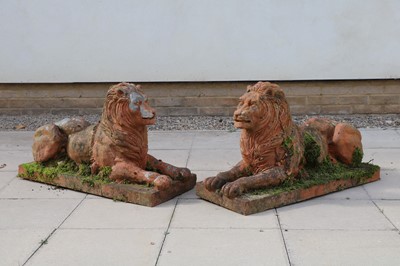 Lot 276 - A pair of earthenware garden lions