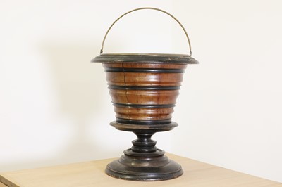 Lot 710 - A walnut and ebonised kettle bucket