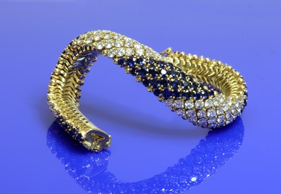 Lot 460 - A four row diamond and sapphire bracelet