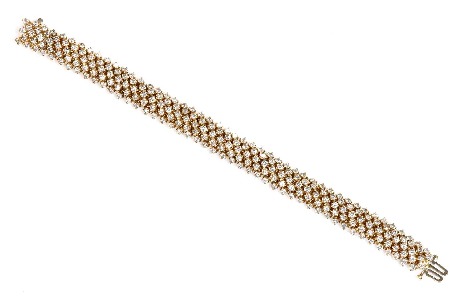 Lot 396 - A Continental three row diamond set bracelet