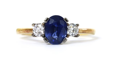 Lot 1219 - An 18ct gold three stone sapphire and diamond ring