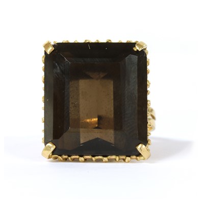 Lot 250 - A gold single stone smoky quartz ring