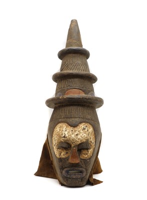 Lot 70 - A North African carved and painted wooden mask
