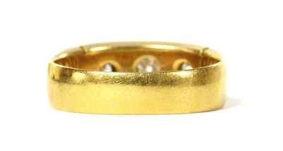 Lot 1003 - A Victorian 22ct gold three stone diamond ring