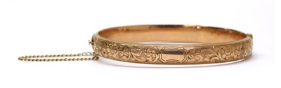 Lot 196 - A 9ct gold hollow oval hinged bangle