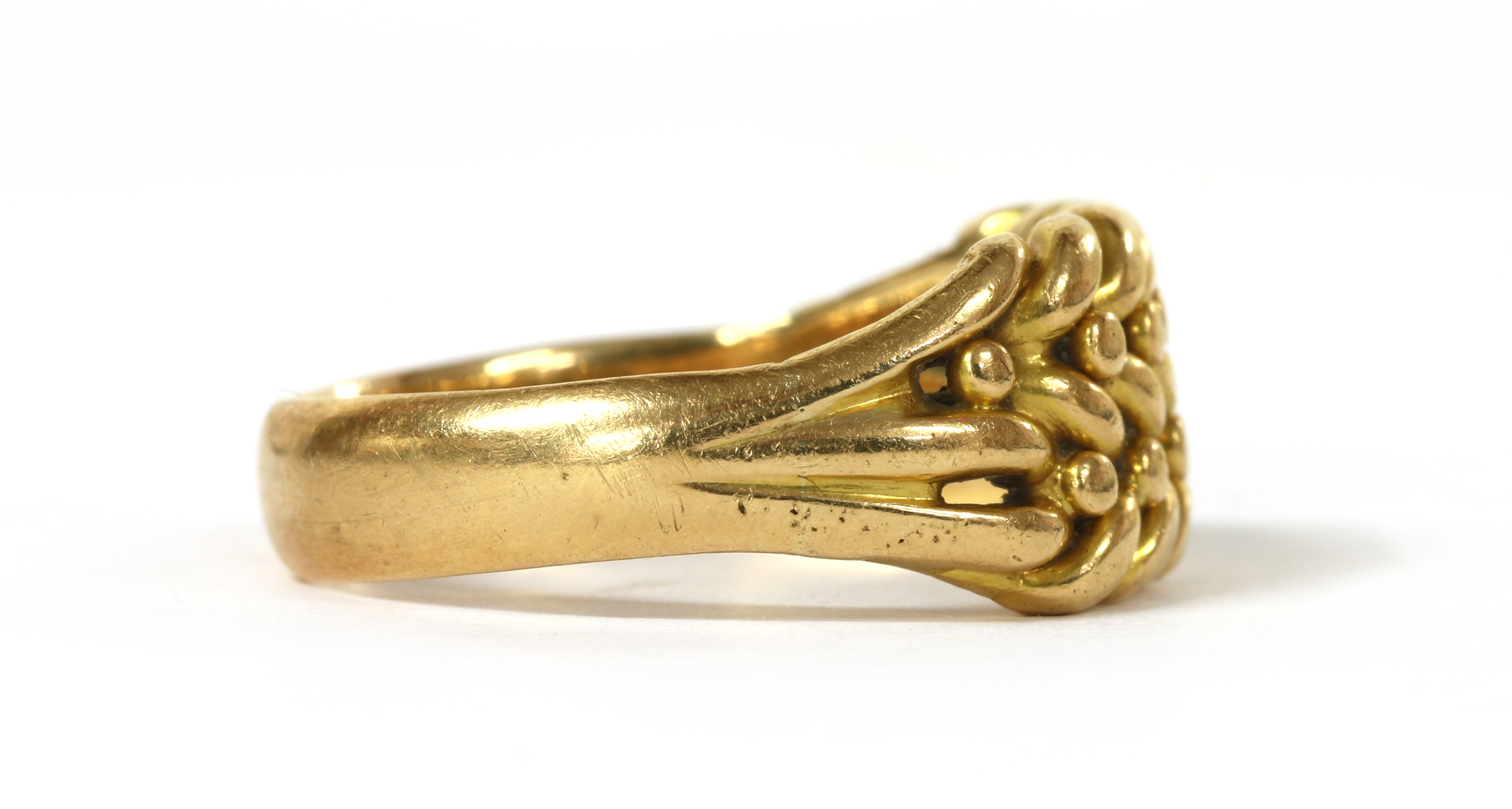 Lot 15 An 18ct gold keeper ring,
