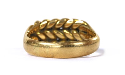 Lot 15 - An 18ct gold keeper ring