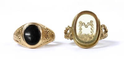 Lot 390 - A gold diamond and resin set initial 'M' ring