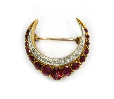 Lot 1139 - A gold ruby and diamond crescent brooch