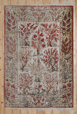 Lot 206 - A Persian silk rug
