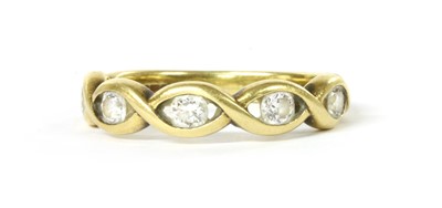 Lot 1101 - An 18ct gold five stone diamond ring