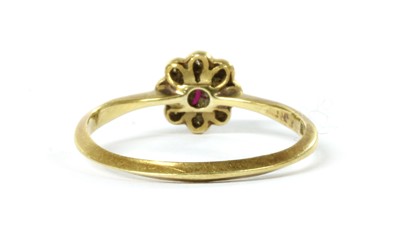 Lot 1035 - A gold ruby and diamond cluster ring