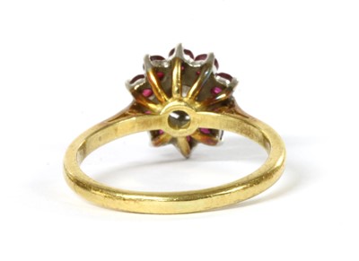 Lot 1151 - An 18ct gold diamond and ruby cluster ring