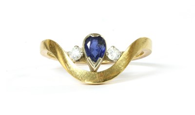 Lot 276 - An 18ct gold sapphire and diamond three stone ring