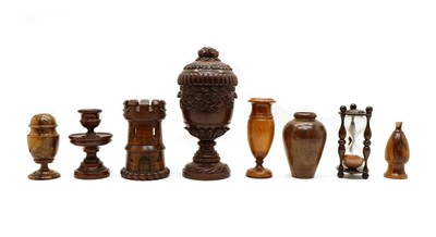 Lot 184 - A carved oak cup and cover