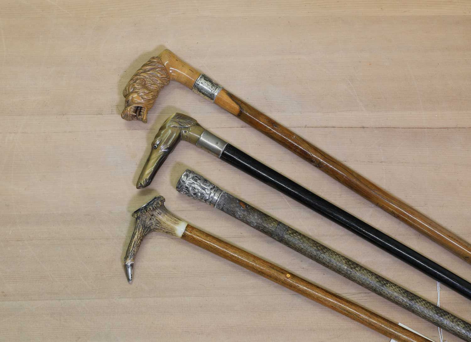 Lot 66 - A group of four walking sticks