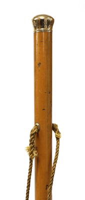 Lot 73 - Two gold-mounted walking canes