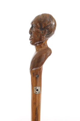 Lot 72 - Three walking sticks with carved head handles