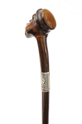 Lot 72 - Three walking sticks with carved head handles