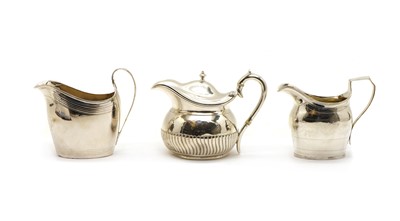 Lot 28A - A George III silver cream jug with ivory insulators