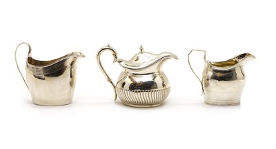 Lot 28 - A George III silver cream jug with ivory insulators