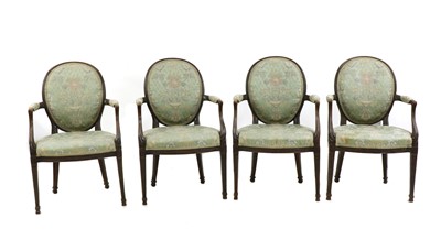 Lot 429 - A set of four oak elbow chairs