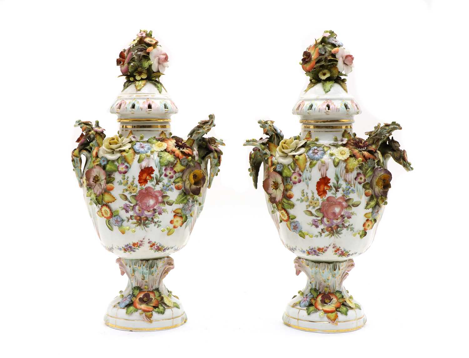 Lot 69 - A pair of Continental lidded porcelain urns