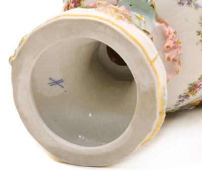 Lot 69 - A pair of Continental lidded porcelain urns
