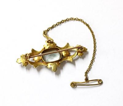 Lot 40 - An Edwardian gold aquamarine and split pearl brooch
