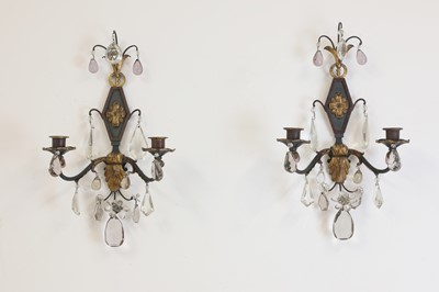 Lot 19 - A pair of metal and gilt-heightened candle sconces