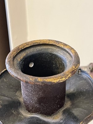 Lot 19 - A pair of metal and gilt-heightened candle sconces