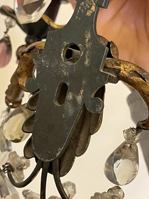 Lot 19 - A pair of metal and gilt-heightened candle sconces