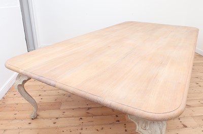 Lot 24 - A large limed oak dining table