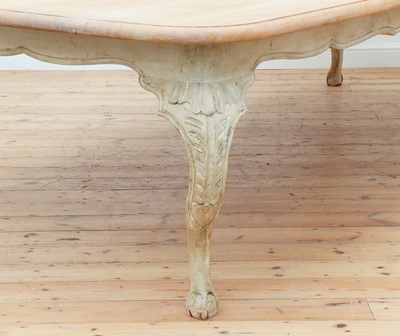 Lot 24 - A large limed oak dining table