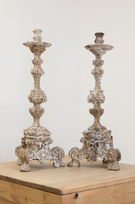 Lot 25 - A pair of baroque carved giltwood candlestands