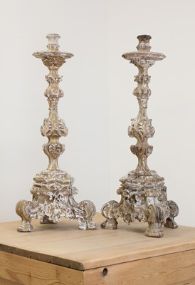Lot 25 - A pair of baroque carved giltwood candlestands