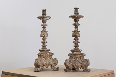 Lot 26 - A pair of baroque carved giltwood candlestands