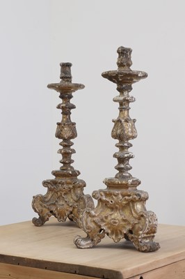 Lot 26 - A pair of baroque carved giltwood candlestands