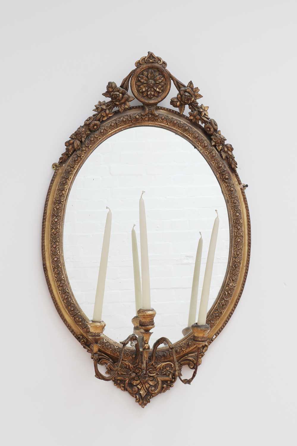 Lot 287 - A three-light oval girandole mirror