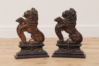 Lot 68 - A pair of cast iron and painted door porters