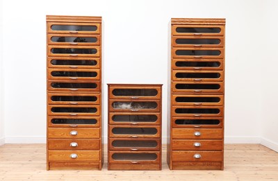 Lot 48 - An oak and glazed haberdasher's cabinet