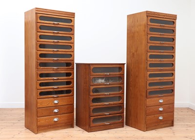 Lot 48 - An oak and glazed haberdasher's cabinet