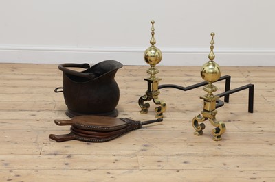 Lot 101 - A pair of brass andirons
