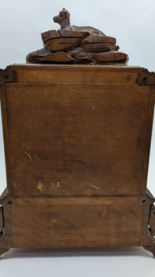 Lot 150 - A Black Forest carved wooden table cabinet