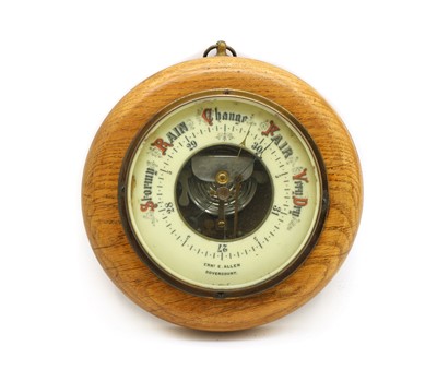Lot 128 - A 1920's oak cased aneroid barometer