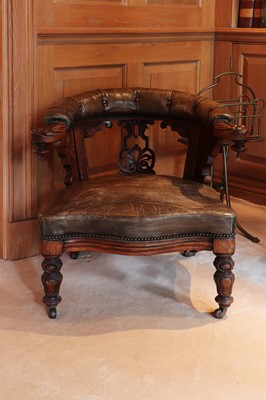 Lot 272 - An oak and leather armchair