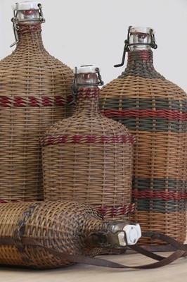 Lot 72 - A group of four wicker-clad bottles